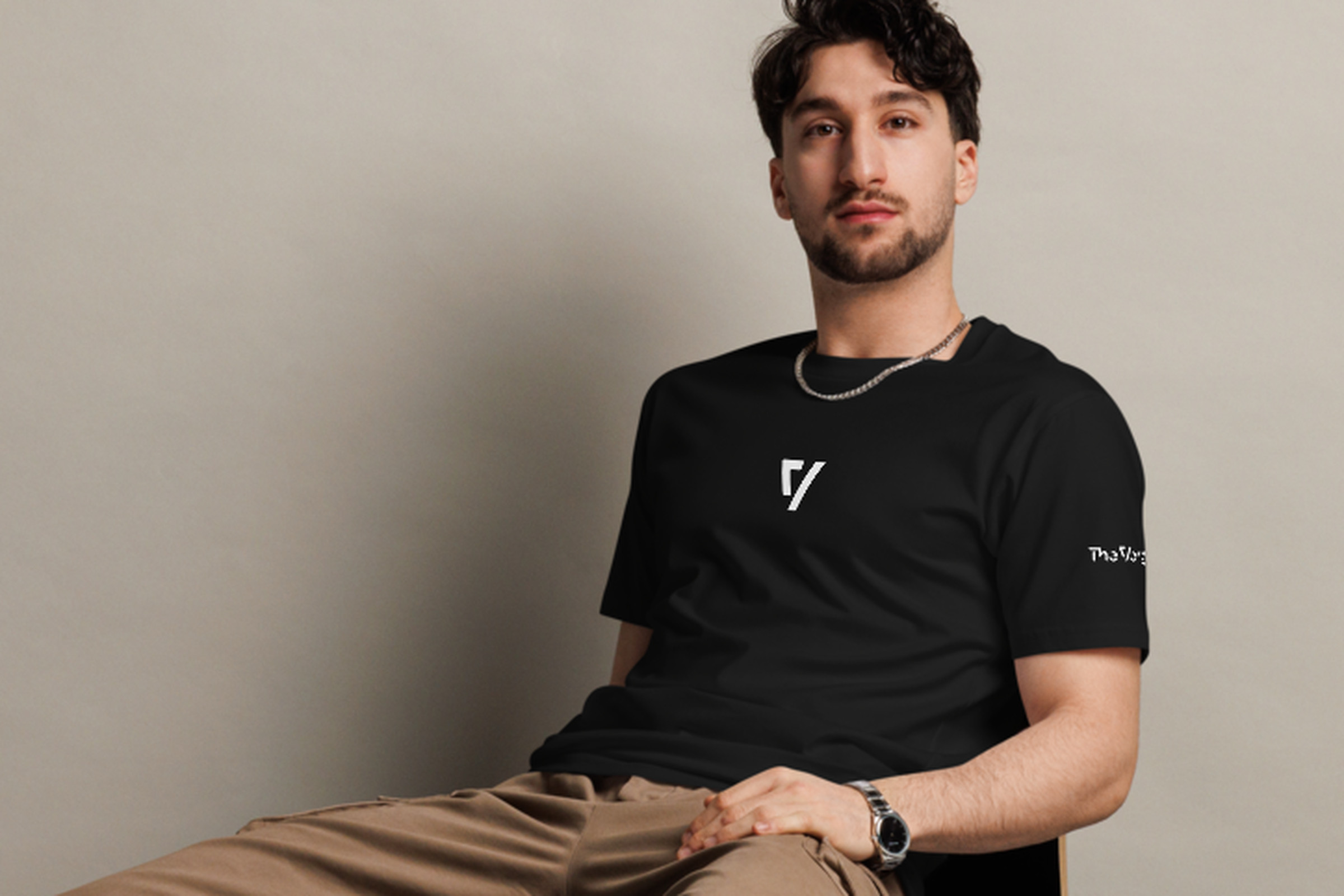 Man wearing black The Verge tee