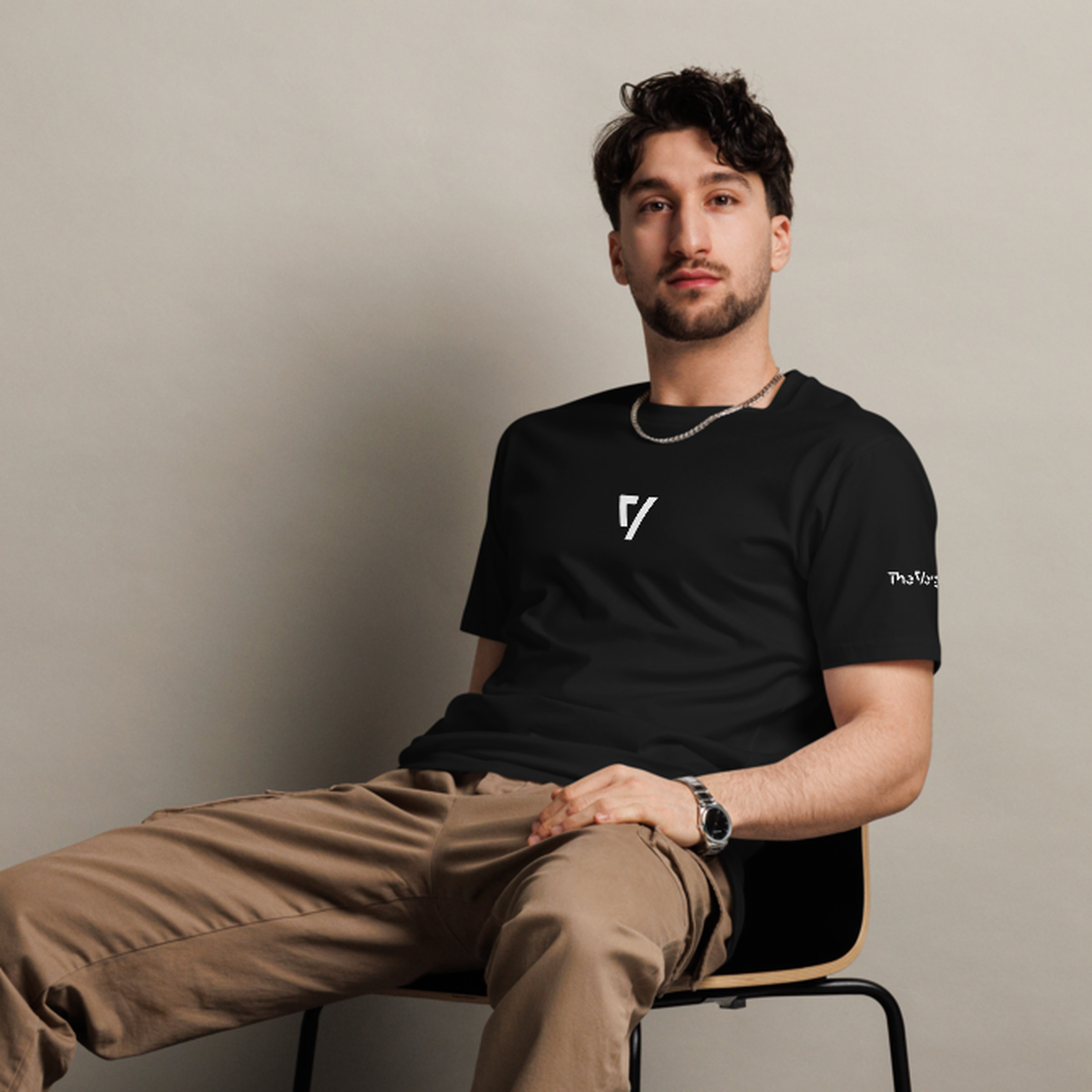 Man wearing black The Verge tee