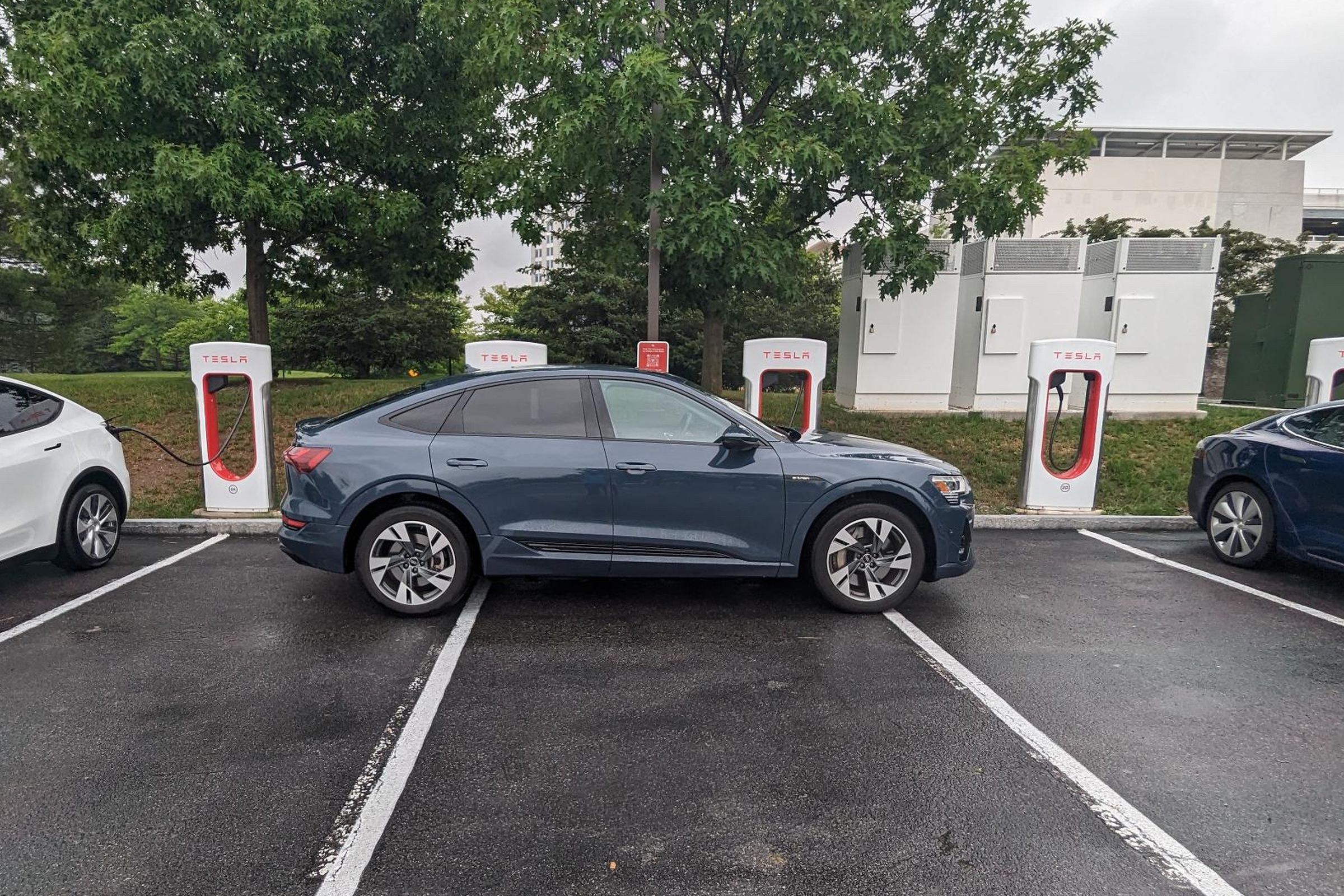 Audi E-tron charging at Tesla Supercharger