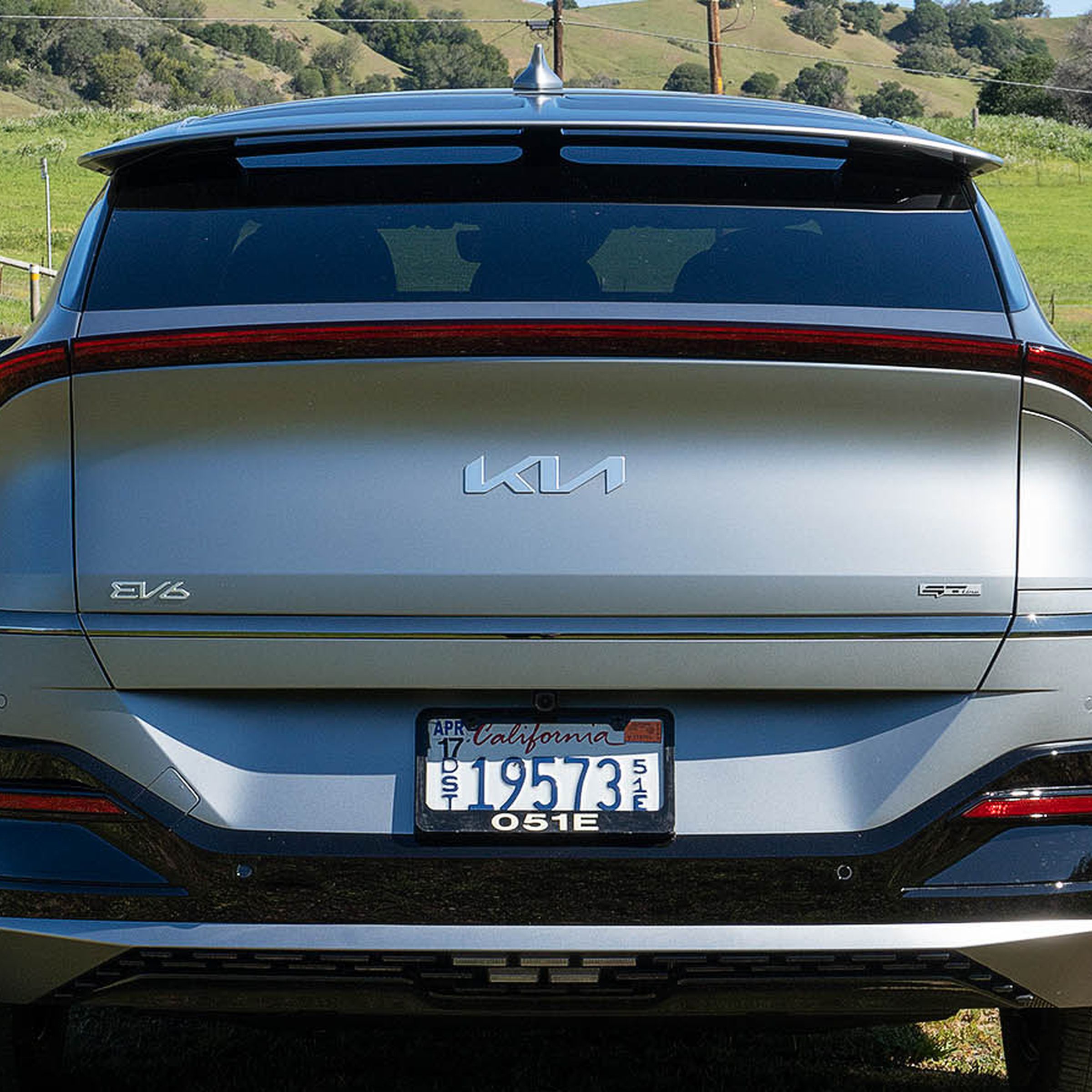 Photo of the Kia EV6, showing the redesigned logo on its hatch.