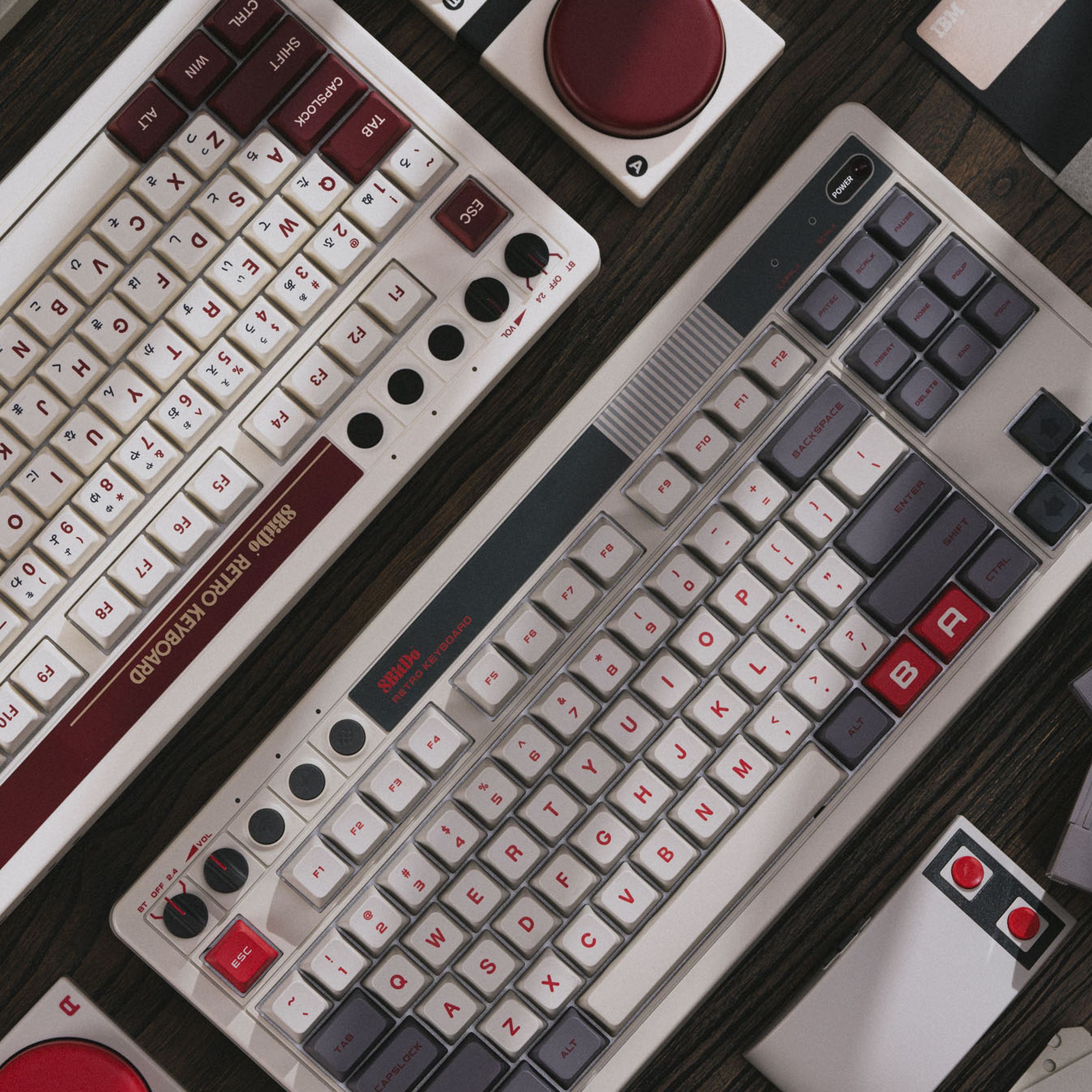 Two keyboards in a sea of retro tech and Nintendo paraphernalia.