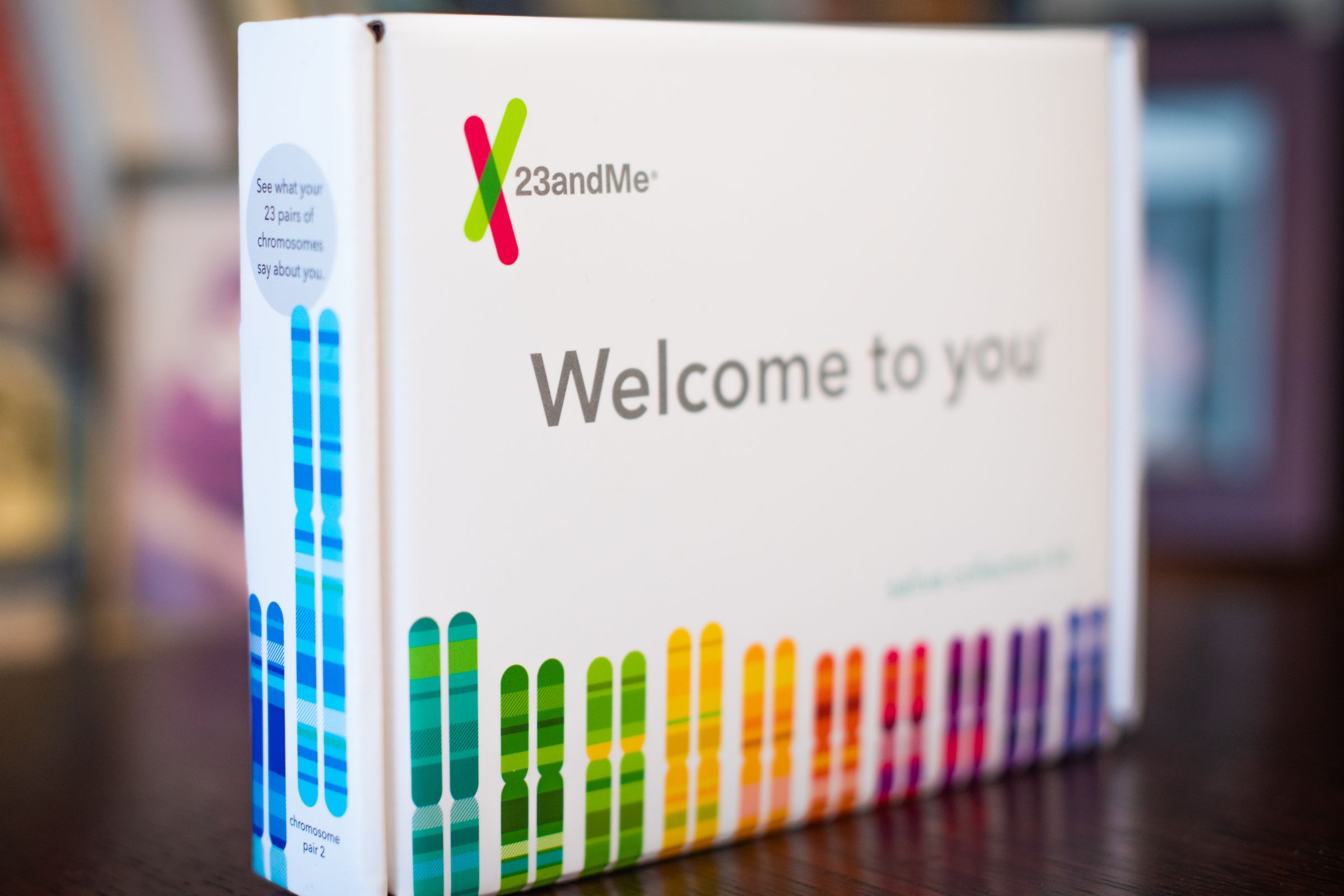 A photo showing a 23andMe DNA testing kit