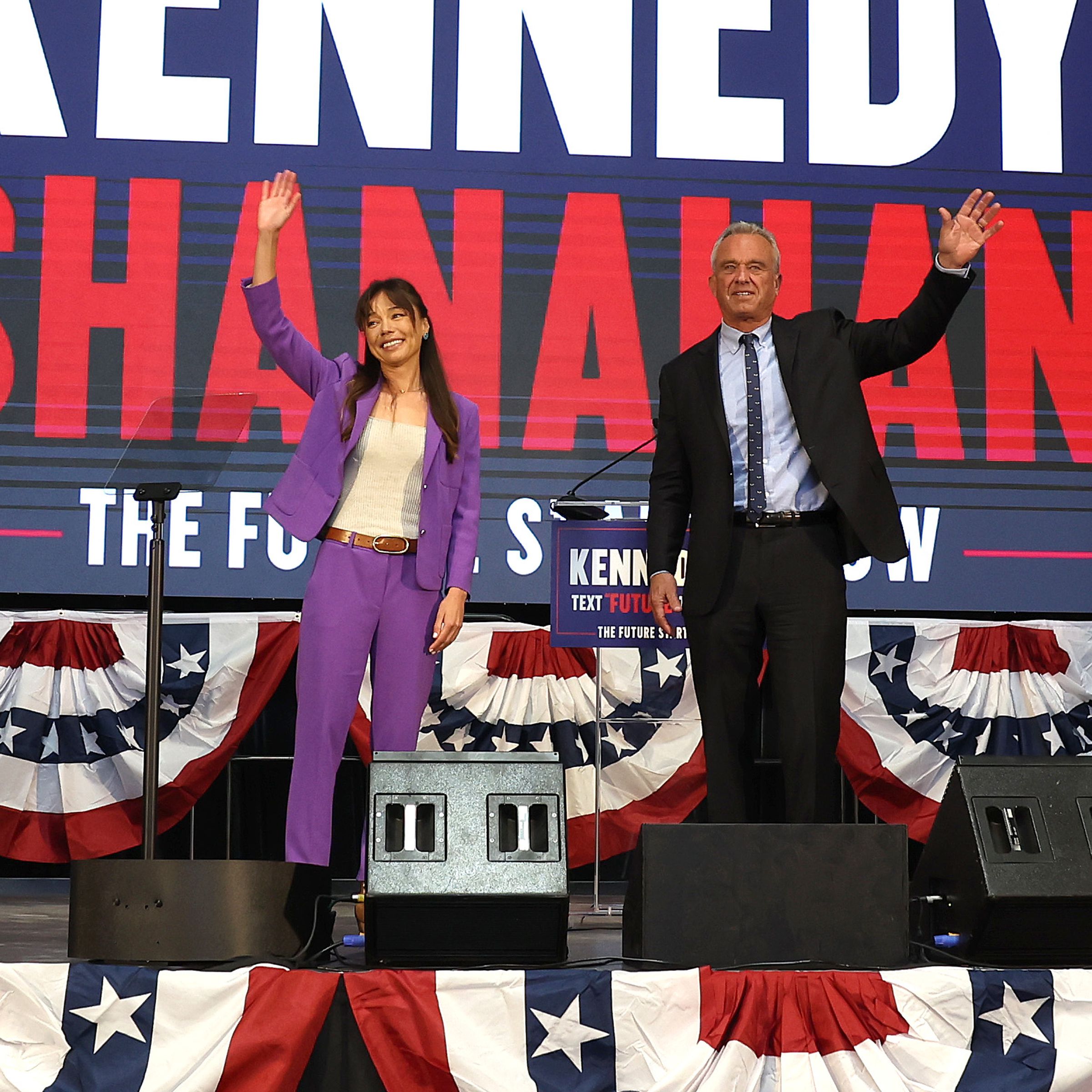 Independent presidential candidate Robert F. Kennedy Jr. (R) and his vice presidential pick Nicole Shanahan take the stage during a campaign event to announce his pick for a running mate at the Henry J. Kaiser Event Center on March 26th, 2024, in Oakland, California.