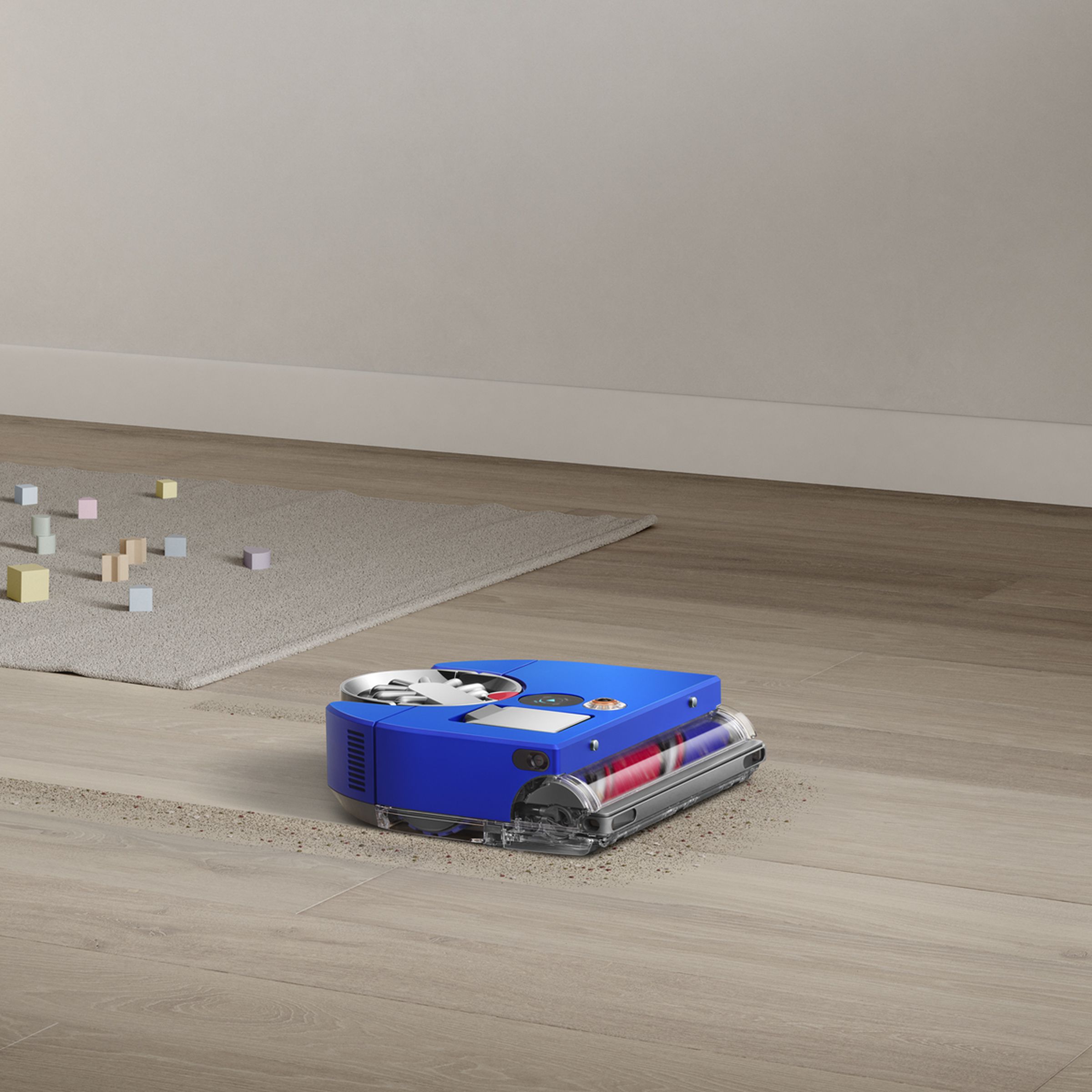 A blue robot vacuum on the floor of a home.